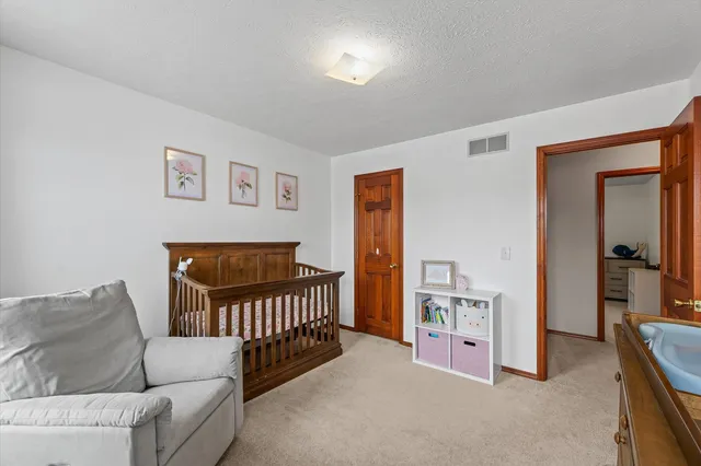 a bathroom with a double vanity sink toilet and shower