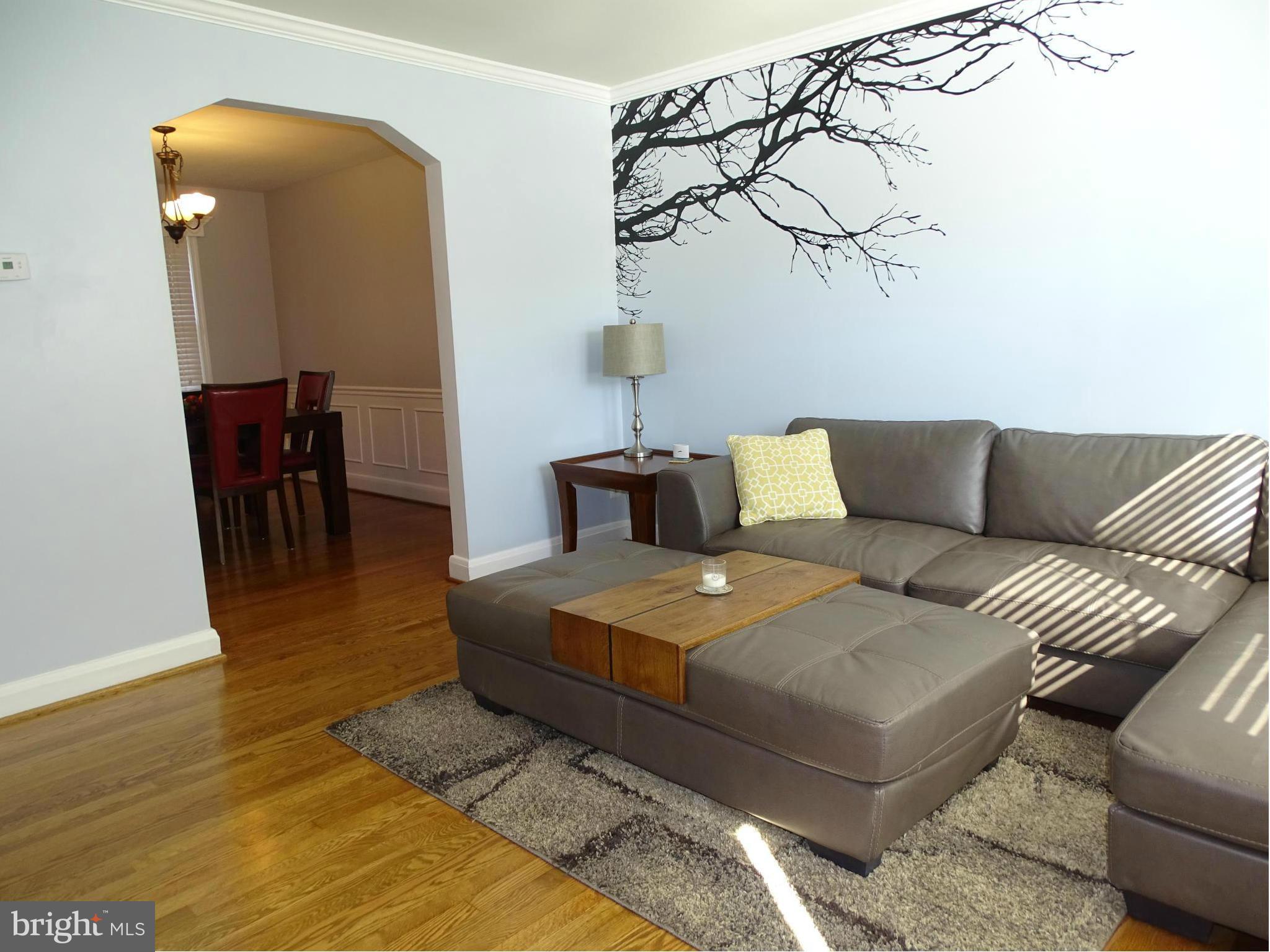 6106 Mt Ridge Road Catonsville, MD 21228 - Photo 2 of 30 a living room with furniture and wooden floor