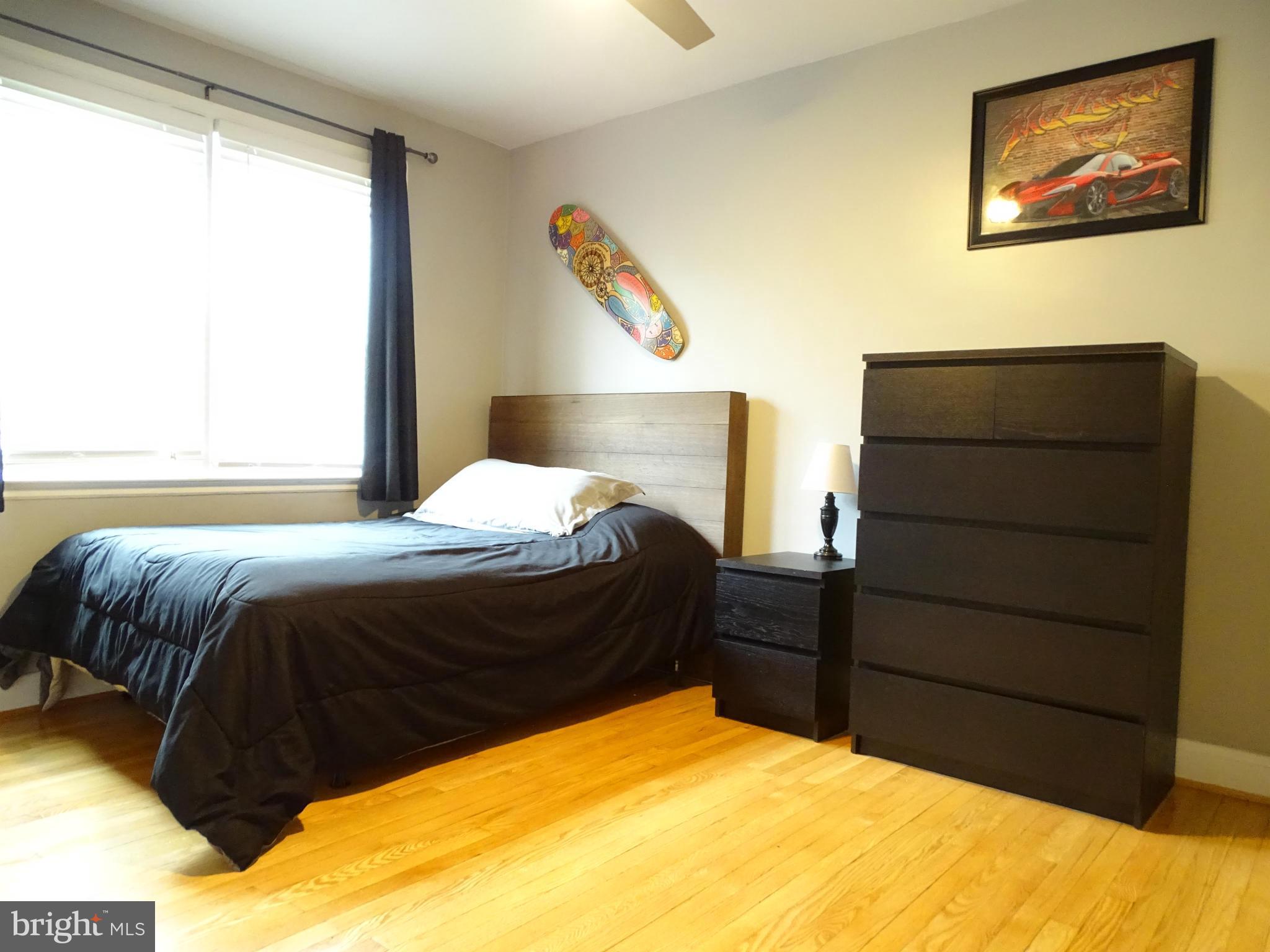 6106 Mt Ridge Road Catonsville, MD 21228 - Photo 14 of 30 a bedroom with a bed and cabinet