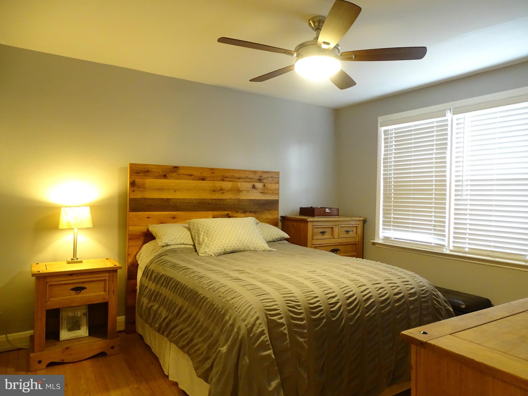6106 Mt Ridge Road Catonsville, MD 21228 - Photo 17 of 30 a bedroom with a bed and a chandelier