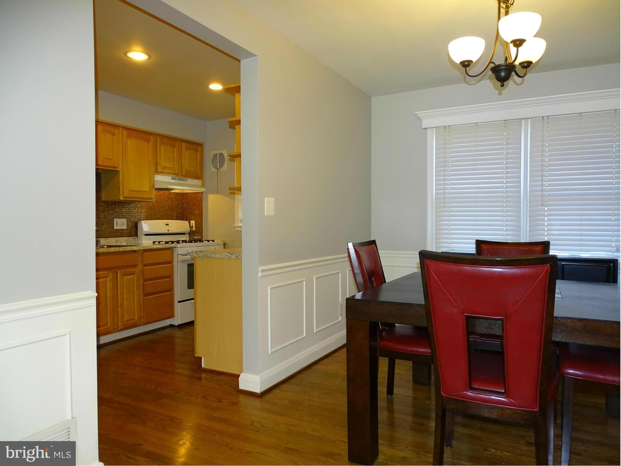 6106 Mt Ridge Road Catonsville, MD 21228 - Photo 3 of 30 a view of a dining room with furniture and wooden floor