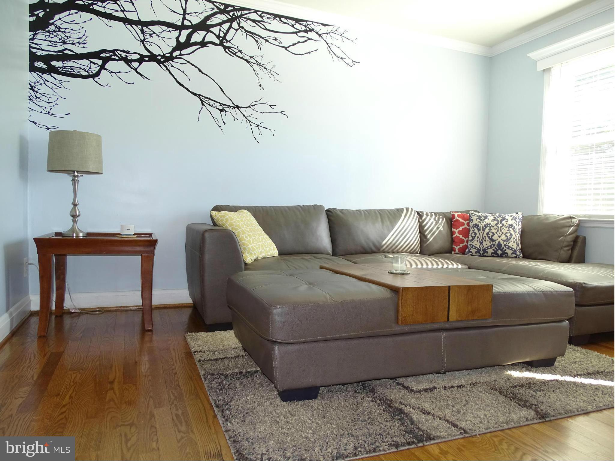 6106 Mt Ridge Road Catonsville, MD 21228 - Photo 5 of 30 a living room with a couch and a table