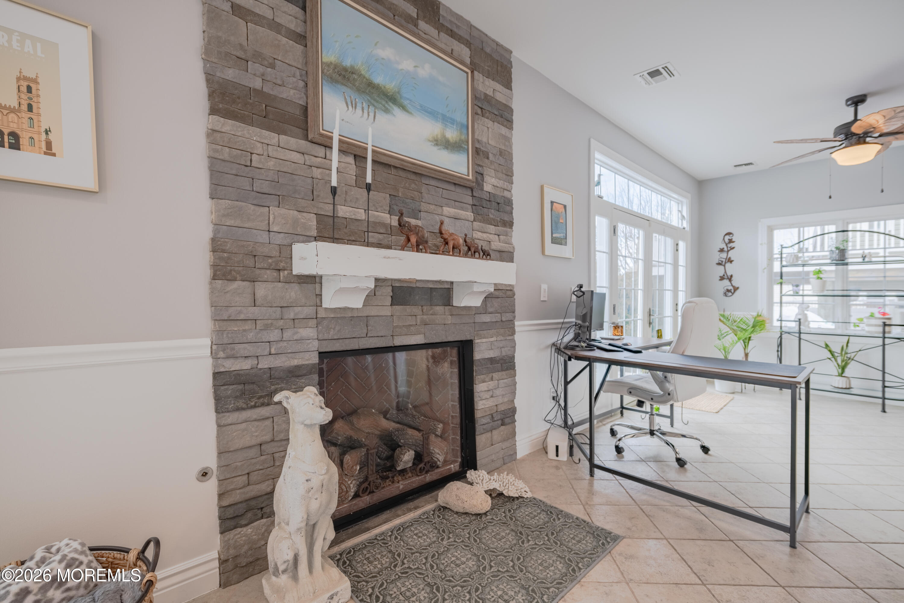27 West Mohawk Drive Little Egg Harbor, NJ 08087 - Photo 11 of 63 a living room with furniture a fireplace and a table