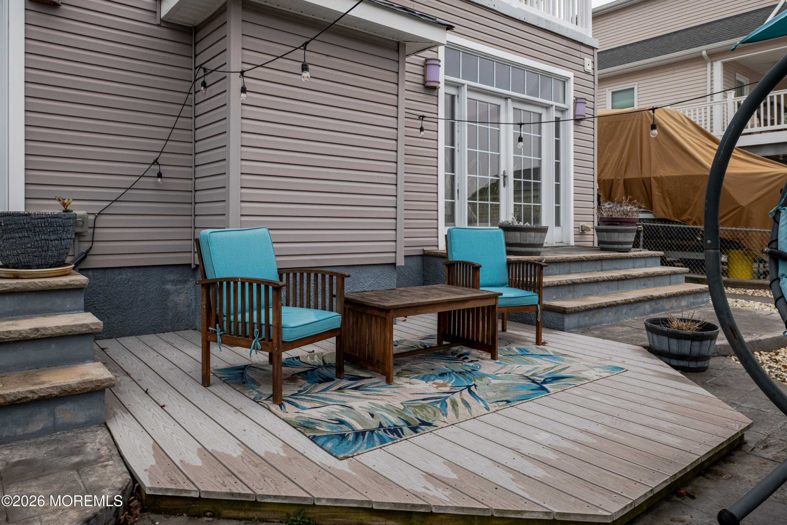 27 West Mohawk Drive Little Egg Harbor, NJ 08087 - Photo 54 of 63 a view of a chairs and tables in the back yard of the house