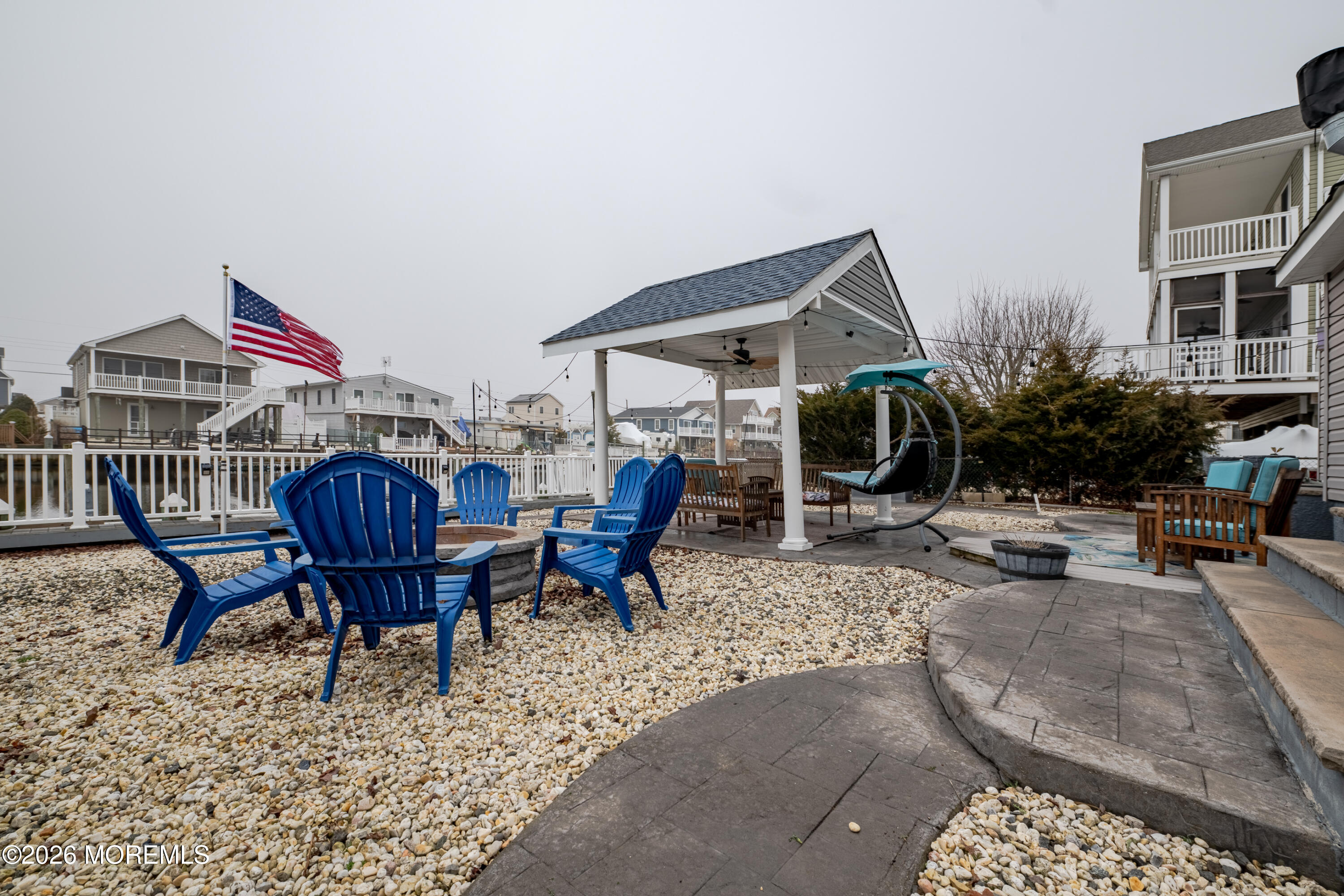 27 West Mohawk Drive Little Egg Harbor, NJ 08087 - Photo 56 of 63 a view of a chairs and table in the patio