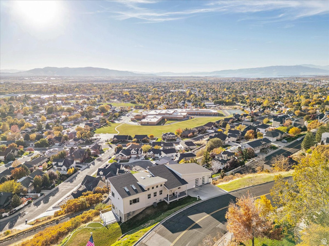 1800 Spring Oaks Drive Springville, UT 84663 - Photo 8 of 68 Aerial view of residential area with a mountain backdrop