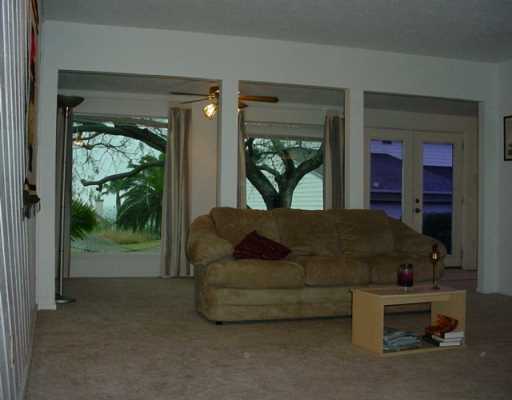 1453 Moore Avenue, Unit C2 Portland, TX 78374 - Photo 2 of 10 a living room with furniture and a flat screen tv
