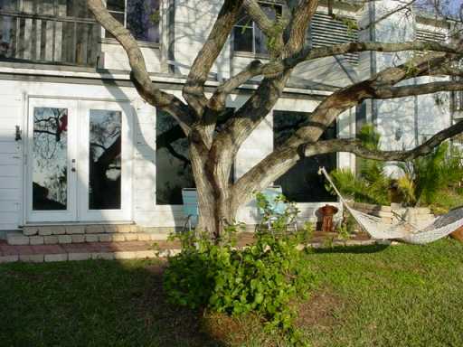 1453 Moore Avenue, Unit C2 Portland, TX 78374 - Photo 10 of 10 a view of a house with a yard