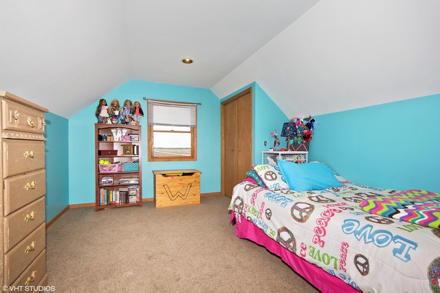 3325 East 19th Road Ottawa, IL 61350 - Photo 11 of 20 a bedroom with a bed and a dresser in it