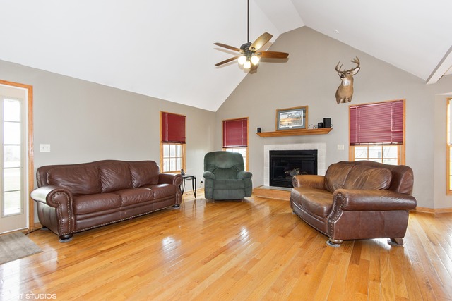 3325 East 19th Road Ottawa, IL 61350 - Photo 3 of 20 a living room with furniture a fireplace and a flat screen tv