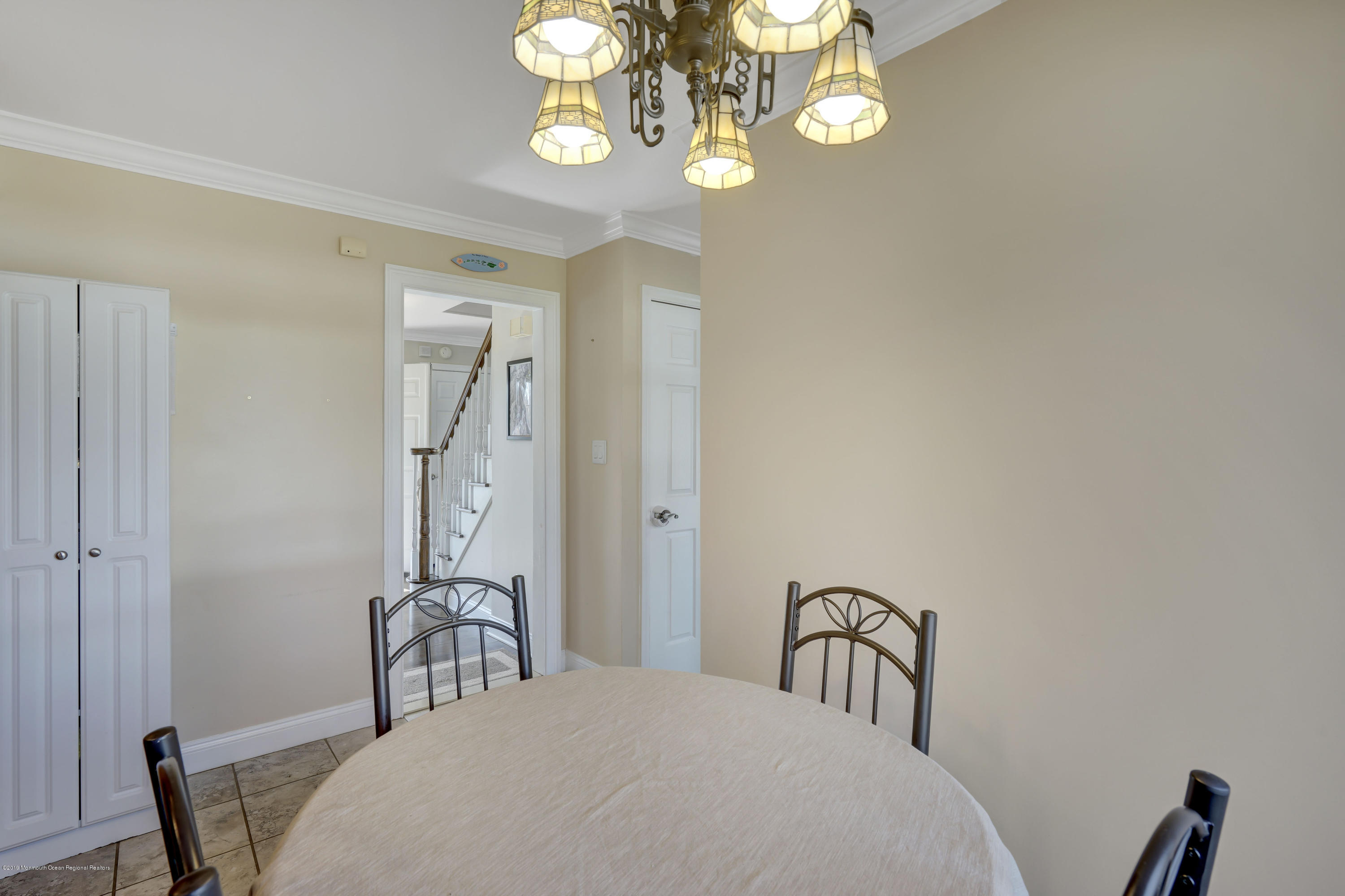 6 High Ridge Road Howell, NJ 07731 - Photo 14 of 40 a bedroom with a bed a chandelier and a window