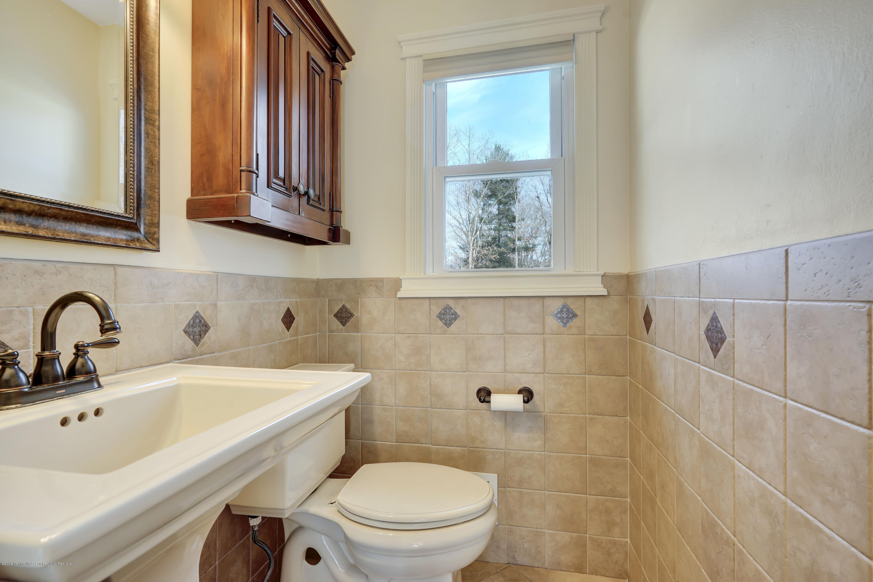 6 High Ridge Road Howell, NJ 07731 - Photo 8 of 40 a bathroom with a sink a toilet and shower