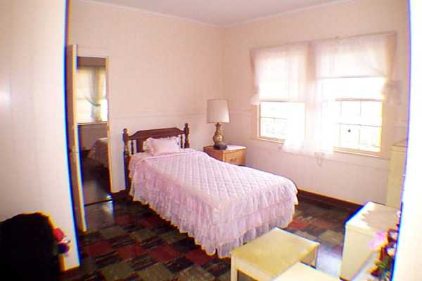 340 Mehana Road Eleele, HI 96705 - Photo 9 of 10 a bedroom with a bed and a window