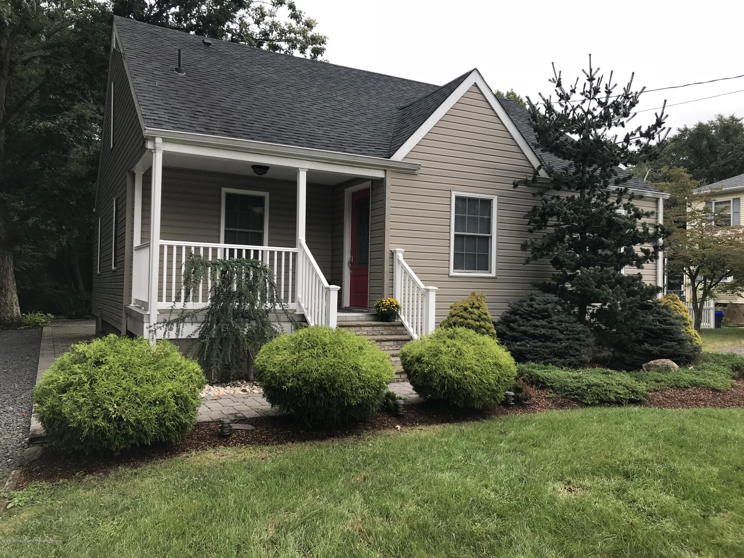 1659 Englishtown Road Old Bridge, NJ 08857 - Photo 4 of 38 a front view of a house with garden