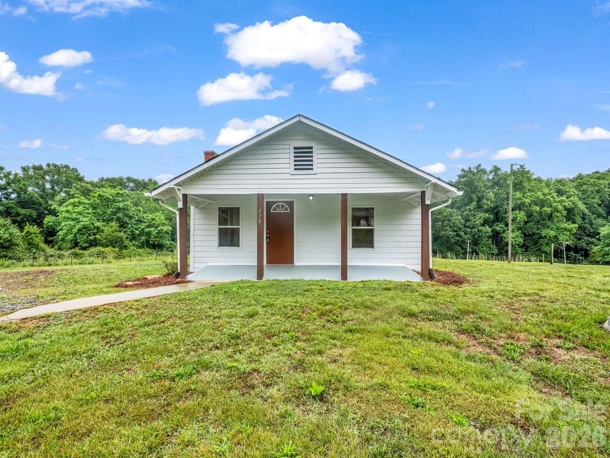 170 Dobbins Road Ellenboro, NC 28040 - Photo 1 of 32 a front view of house with yard and green space