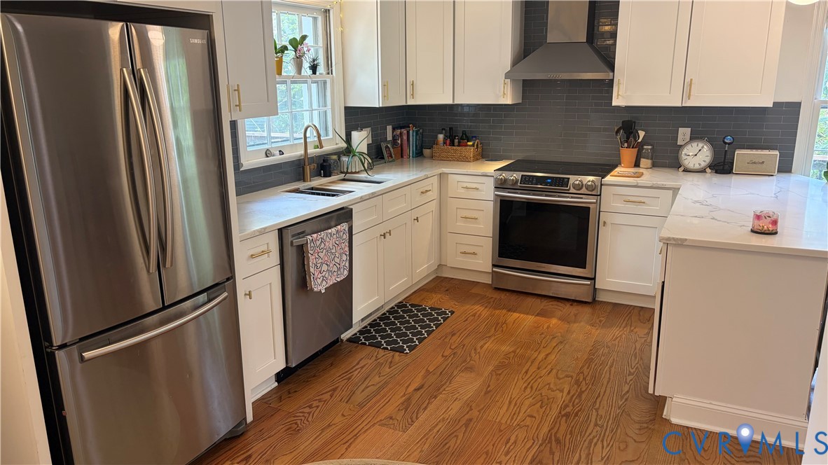 2502 Brookwood Road Richmond, VA 23235 - Photo 15 of 54 a kitchen with a white cabinets and white stainless steel appliances