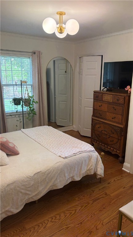 2502 Brookwood Road Richmond, VA 23235 - Photo 35 of 54 a bedroom with a bed and a flat screen tv