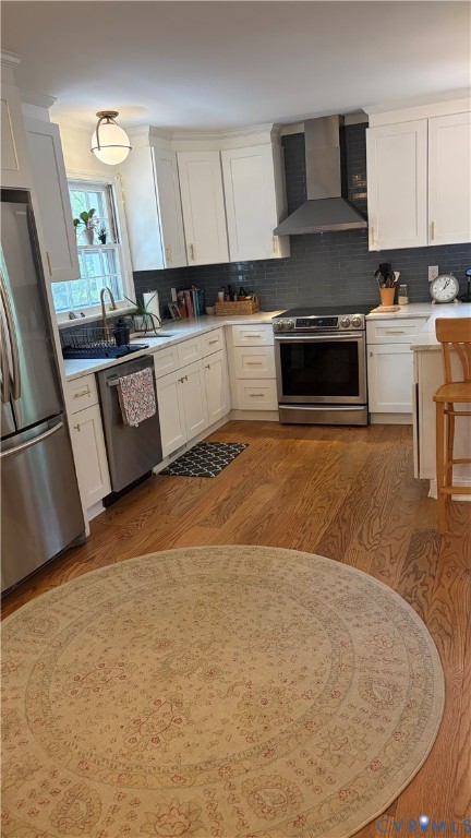 2502 Brookwood Road Richmond, VA 23235 - Photo 38 of 54 a kitchen with stainless steel appliances a stove a sink a microwave a refrigerator a cabinets and wooden floor