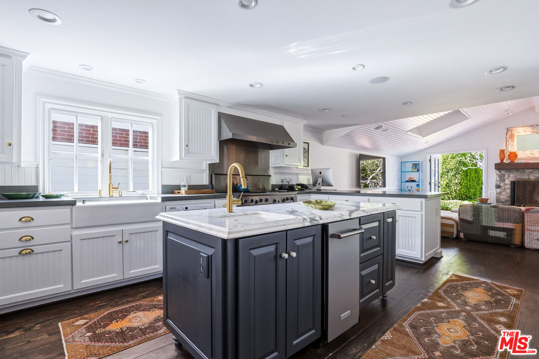 30810 Broad Beach Road Malibu, CA 90265 - Photo 17 of 55 a kitchen with a sink stove and cabinets