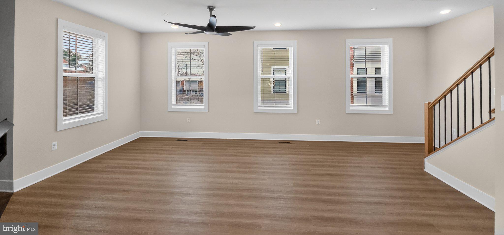 426 Chapel Alley, Unit 8 Frederick, MD 21701 - Photo 15 of 34 a view of an empty room with wooden floor and a window
