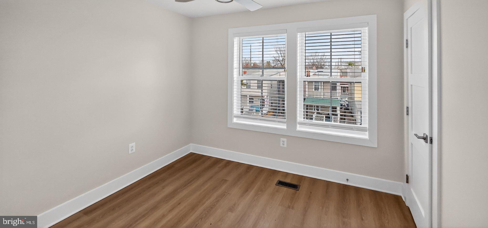 426 Chapel Alley, Unit 8 Frederick, MD 21701 - Photo 27 of 34 a view of a room with wooden floor and windows