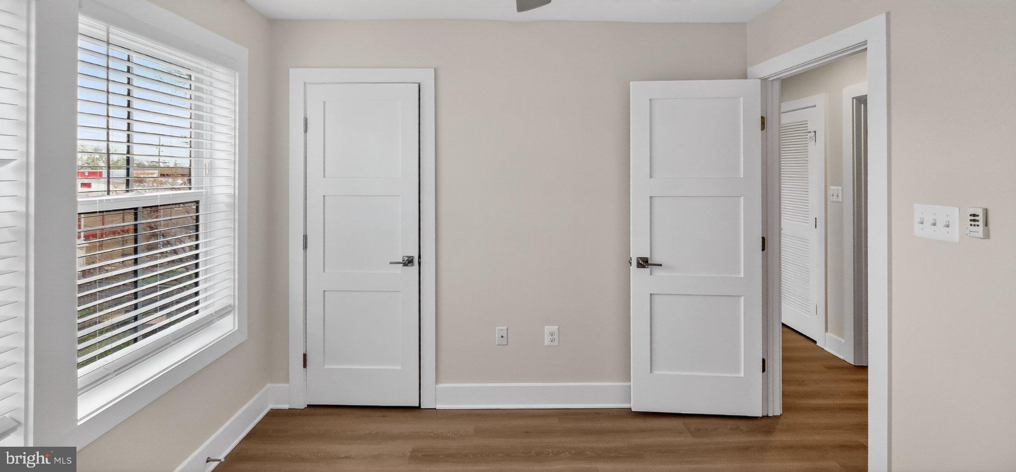 426 Chapel Alley, Unit 8 Frederick, MD 21701 - Photo 28 of 34 a view of a hallway with wooden floor and closet