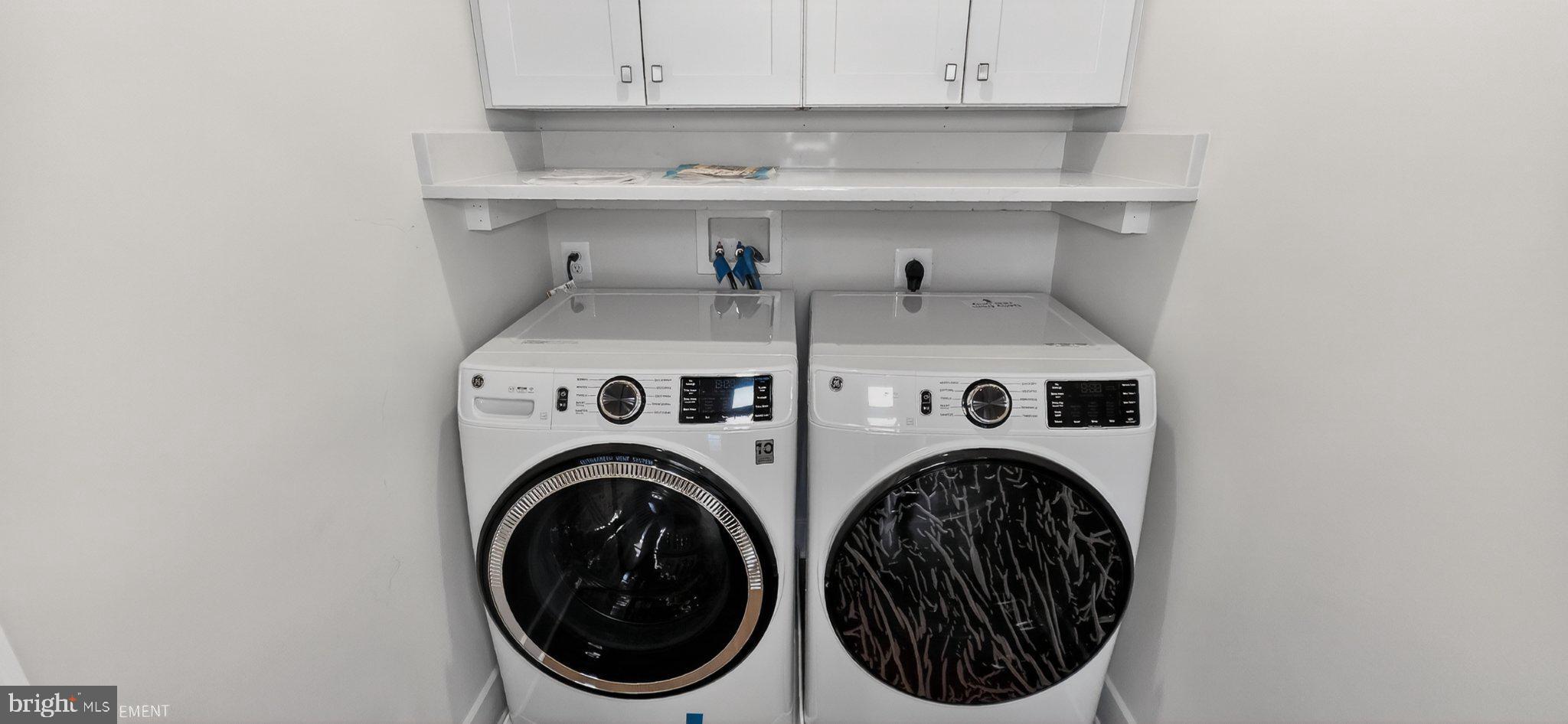 426 Chapel Alley, Unit 8 Frederick, MD 21701 - Photo 34 of 34 a utility room with dryer and washer