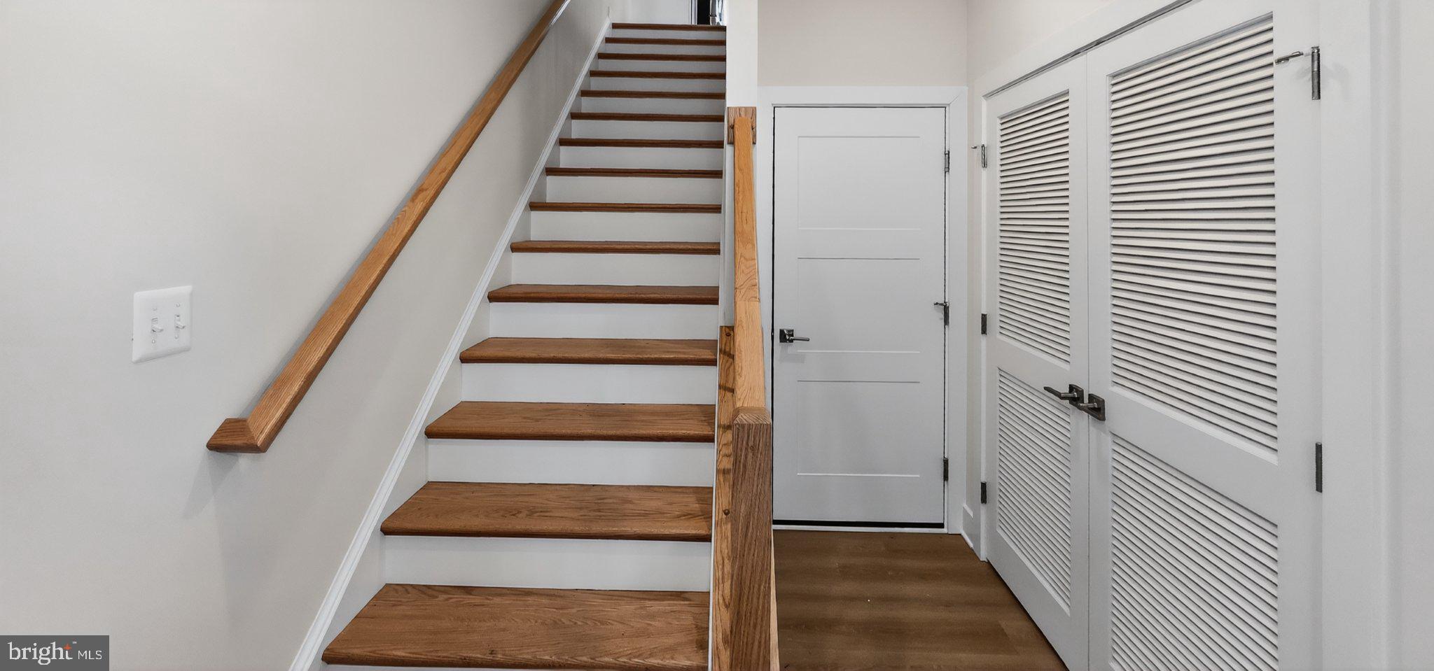 426 Chapel Alley, Unit 8 Frederick, MD 21701 - Photo 5 of 34 a view of a hallway with wooden floor and windows
