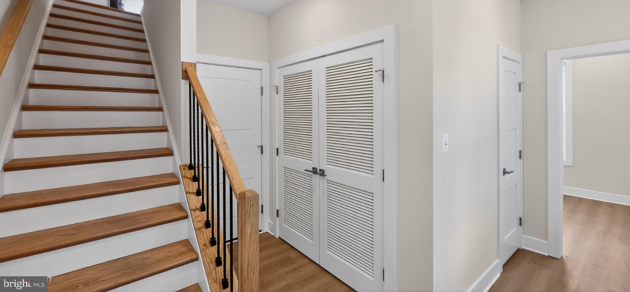 426 Chapel Alley, Unit 8 Frederick, MD 21701 - Photo 6 of 34 a view of a hallway with wooden floor and windows