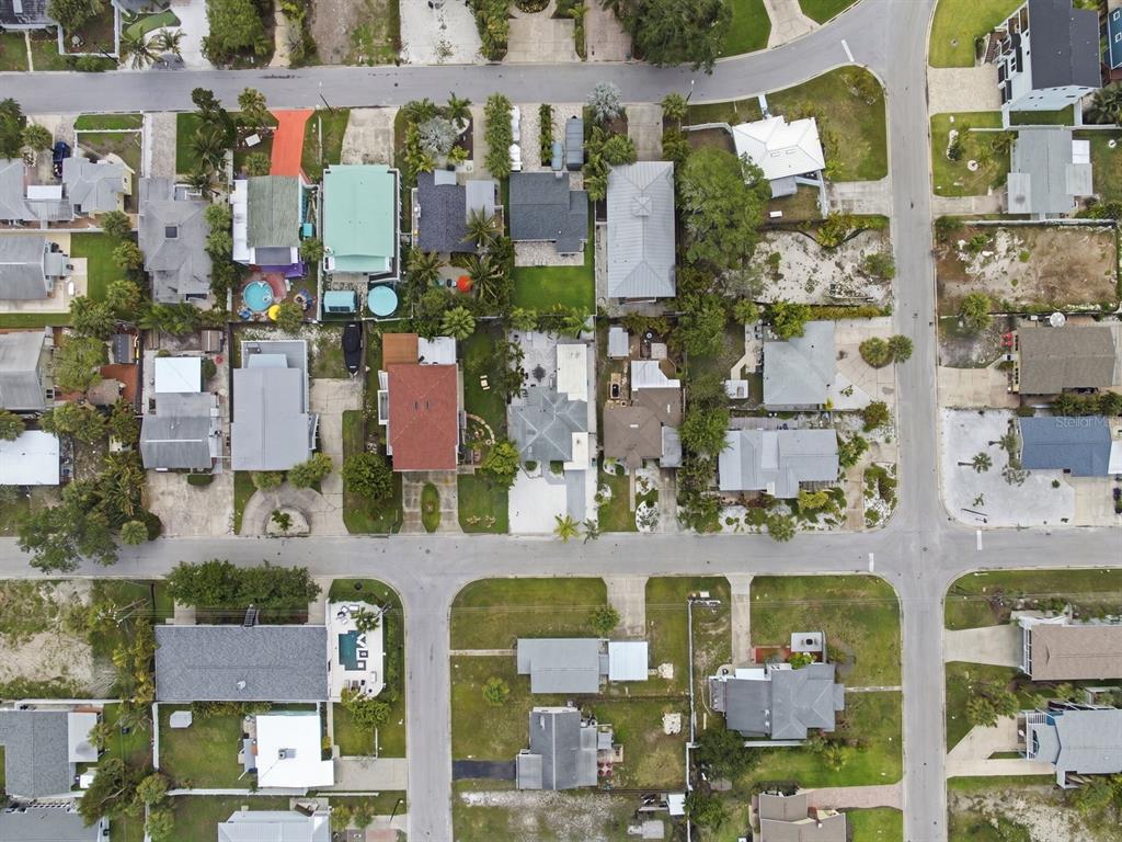 1207 1st Street Indian Rocks Beach, FL 33785 - Photo 48 of 60 an aerial view of residential houses with street and parking