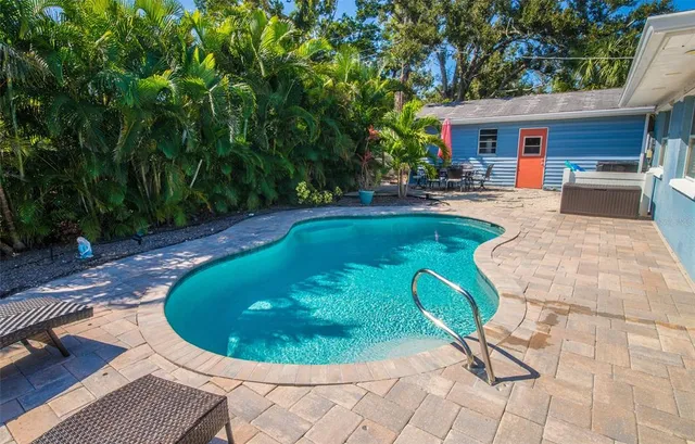 a view of a swimming pool with seating