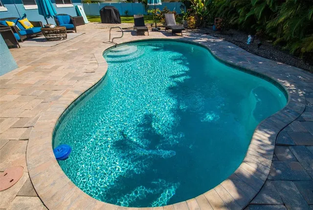 a view of a swimming pool with a sitting space