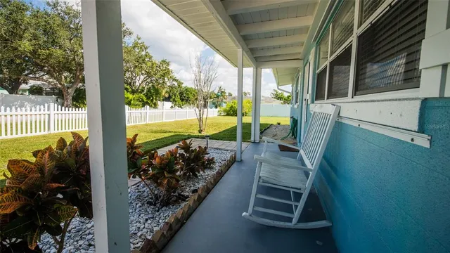 a view of a porch with furniture