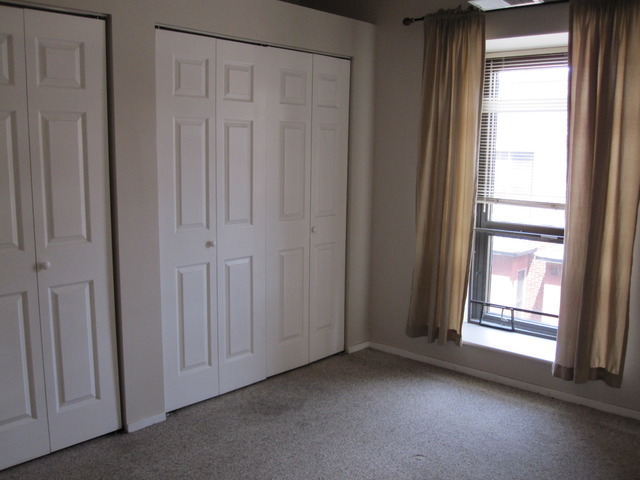 811 South Lytle Street, Unit 212 Chicago, IL 60607 - Photo 10 of 14 a view of empty room with windows