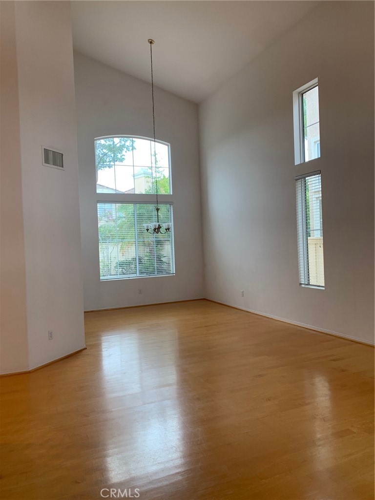 1 Pompeii Irvine, CA 92606 - Photo 2 of 10 an empty room with wooden floor and windows