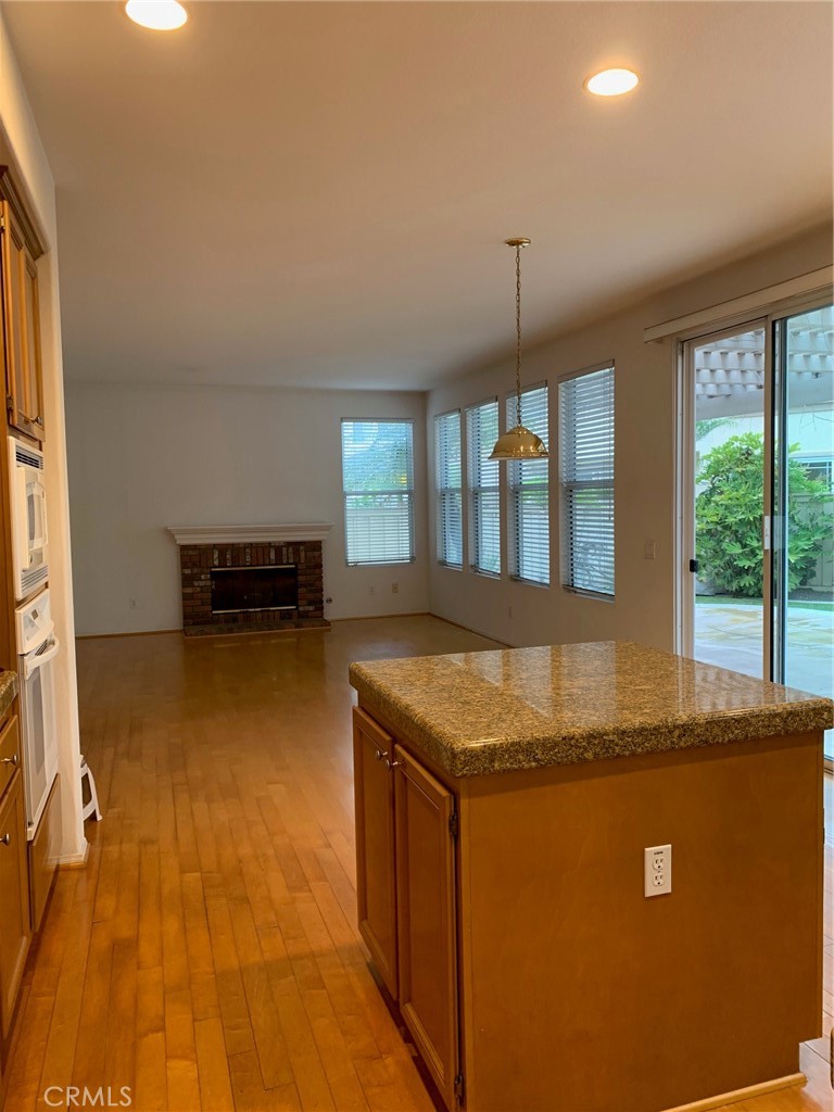 1 Pompeii Irvine, CA 92606 - Photo 4 of 10 a kitchen with stainless steel appliances granite countertop a stove a sink and a refrigerator