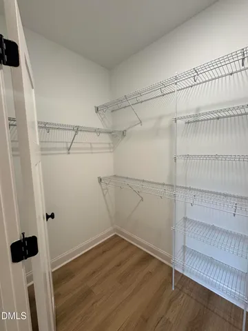 a view of a room with racks on the wall