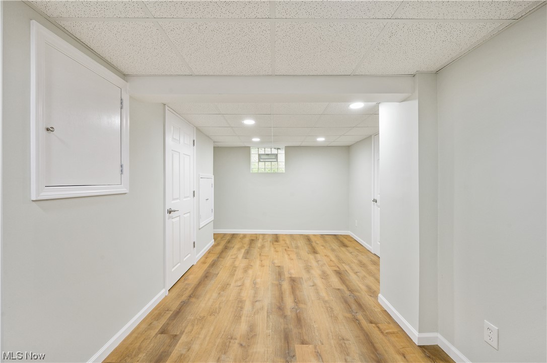 1606 Maple Road Cleveland Heights, OH 44121 - Photo 27 of 30 Partially finished basement offers options for family/recreation room or working space and renovated full bathroom(2023) with walk-in shower, sliding shower door and single vanity