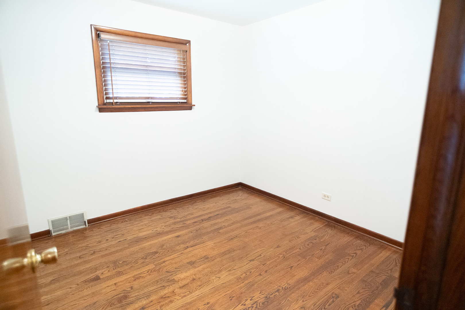 6645 Riverside Drive Tinley Park, IL 60477 - Photo 11 of 38 an empty room with wooden floor and windows