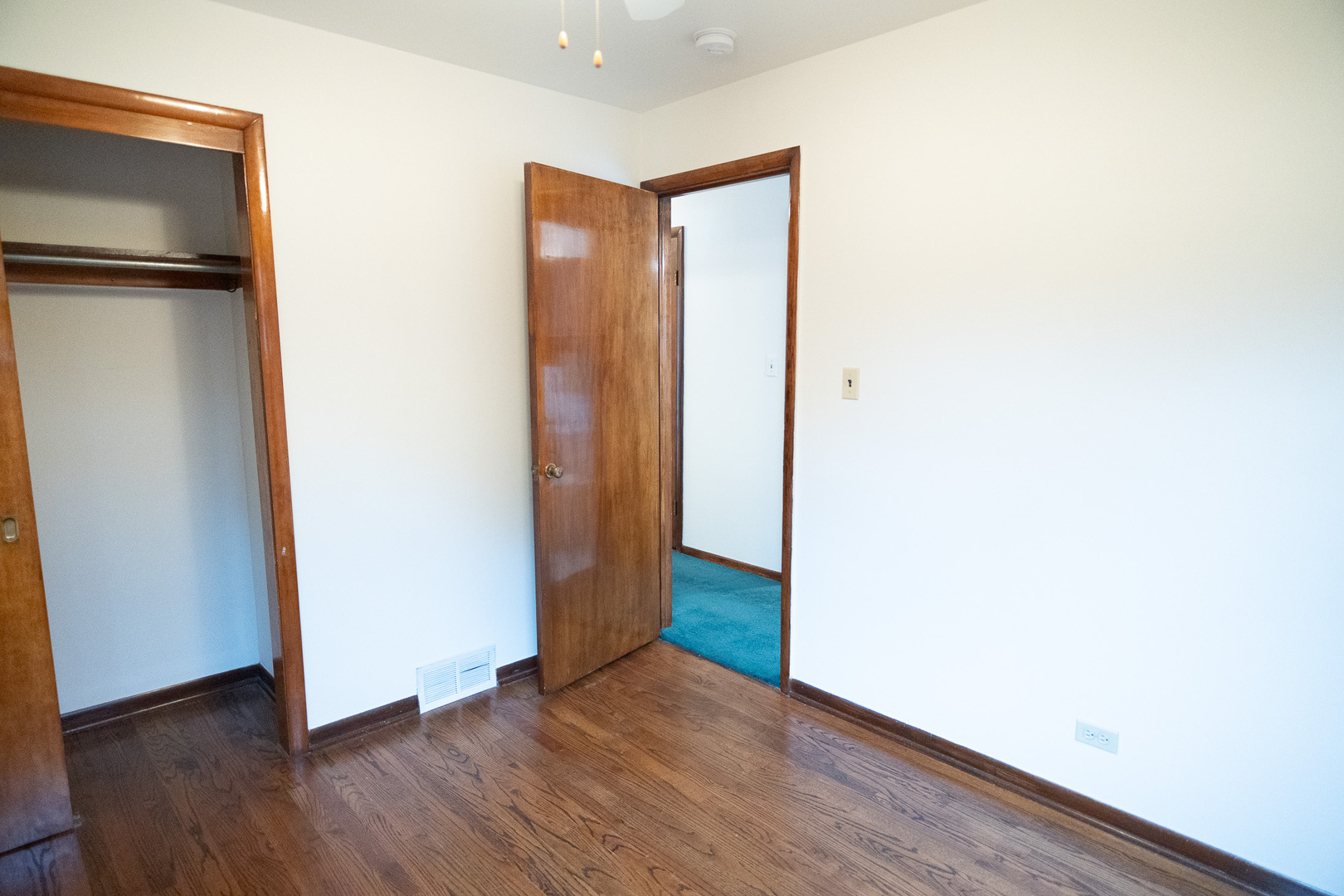 6645 Riverside Drive Tinley Park, IL 60477 - Photo 13 of 38 a view of an empty room with wooden floor