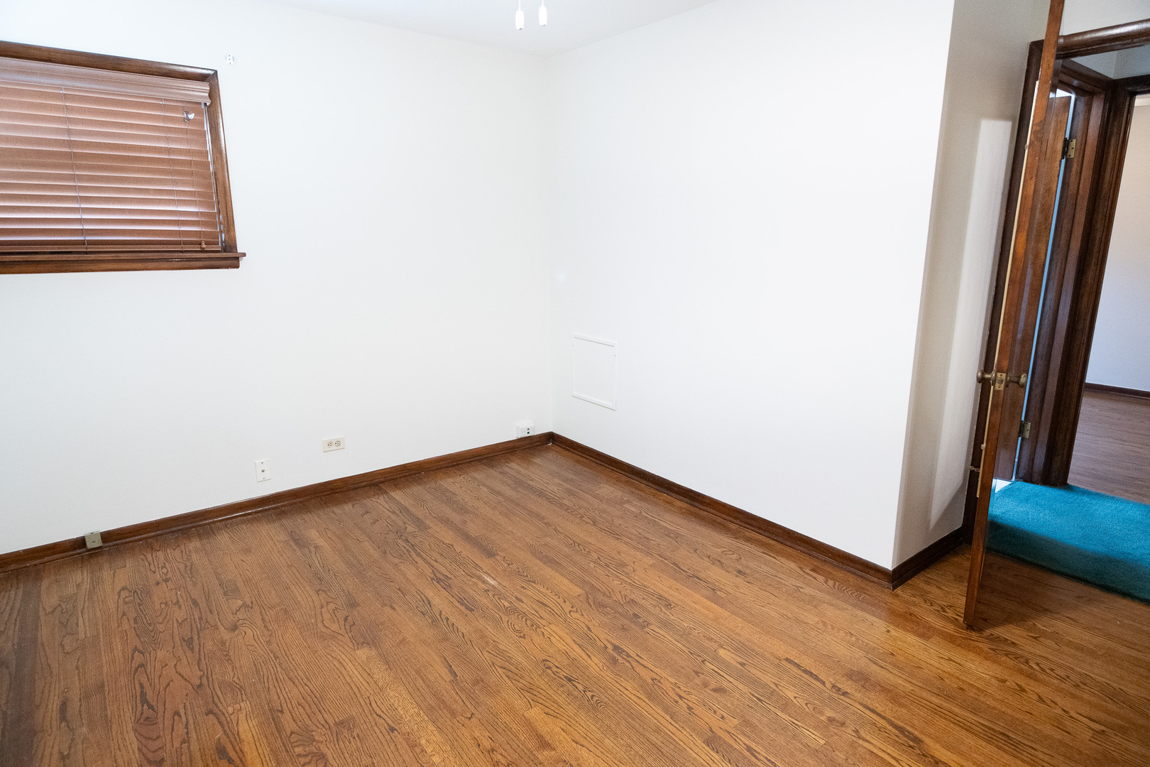 6645 Riverside Drive Tinley Park, IL 60477 - Photo 16 of 38 a view of a room with wooden floor and a window