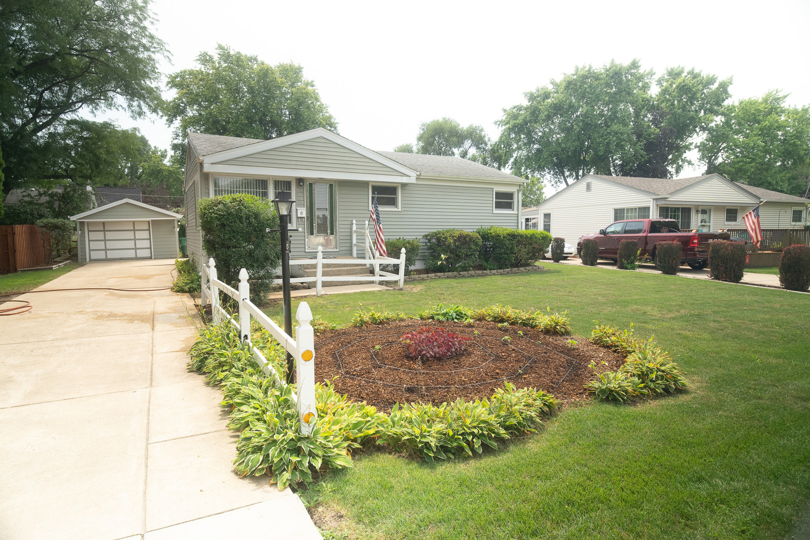 6645 Riverside Drive Tinley Park, IL 60477 - Photo 2 of 38 a front view of a house with a yard