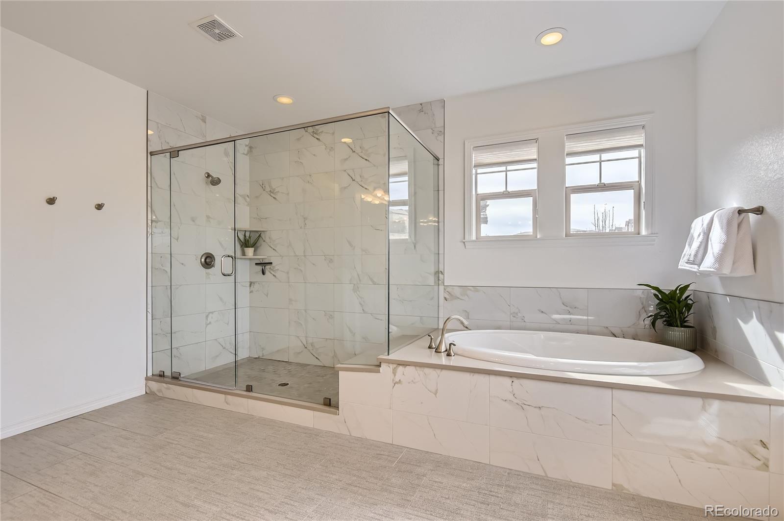 10610 Greycliffe Drive Highlands Ranch, CO 80126 - Photo 29 of 49 a white bath tub sitting next to a shower