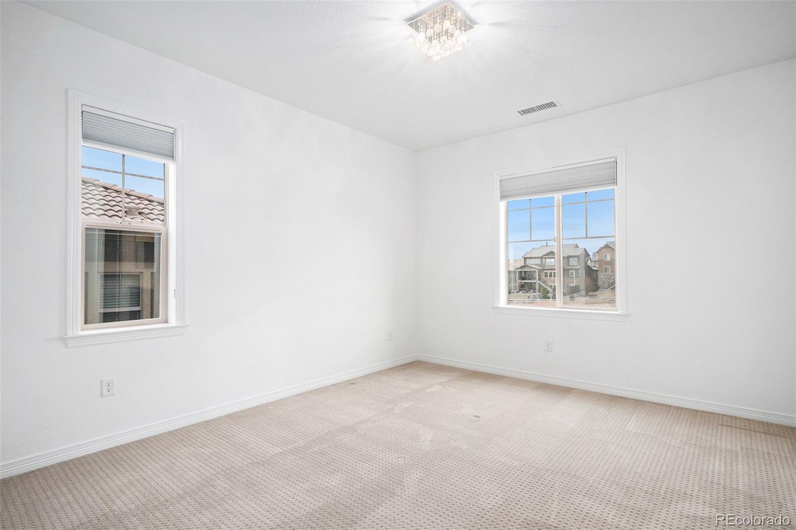 10610 Greycliffe Drive Highlands Ranch, CO 80126 - Photo 31 of 49 an empty room with a window