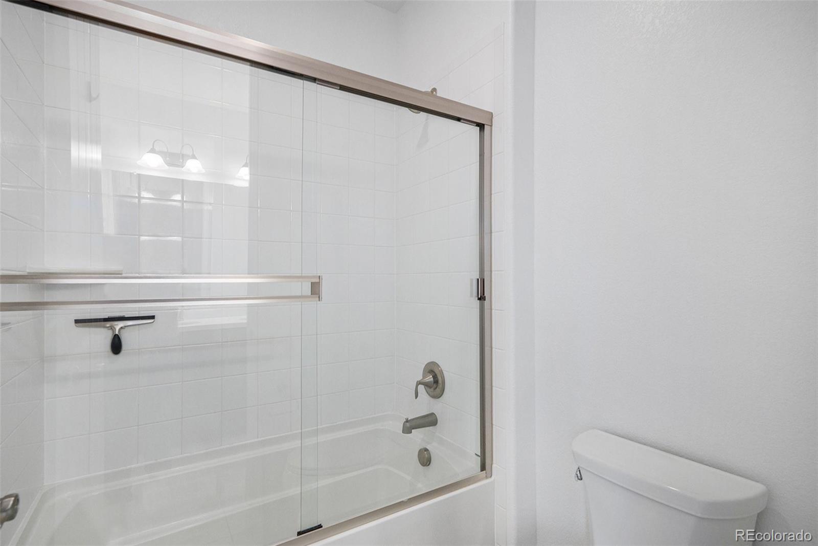 10610 Greycliffe Drive Highlands Ranch, CO 80126 - Photo 33 of 49 a bathroom with a shower and toilet
