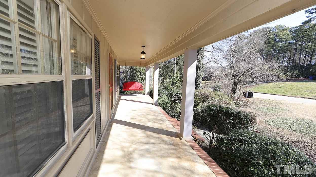 4115 Rockingham Drive Raleigh, NC 27609 - Photo 14 of 23 a view of a pathway of a house with a yard