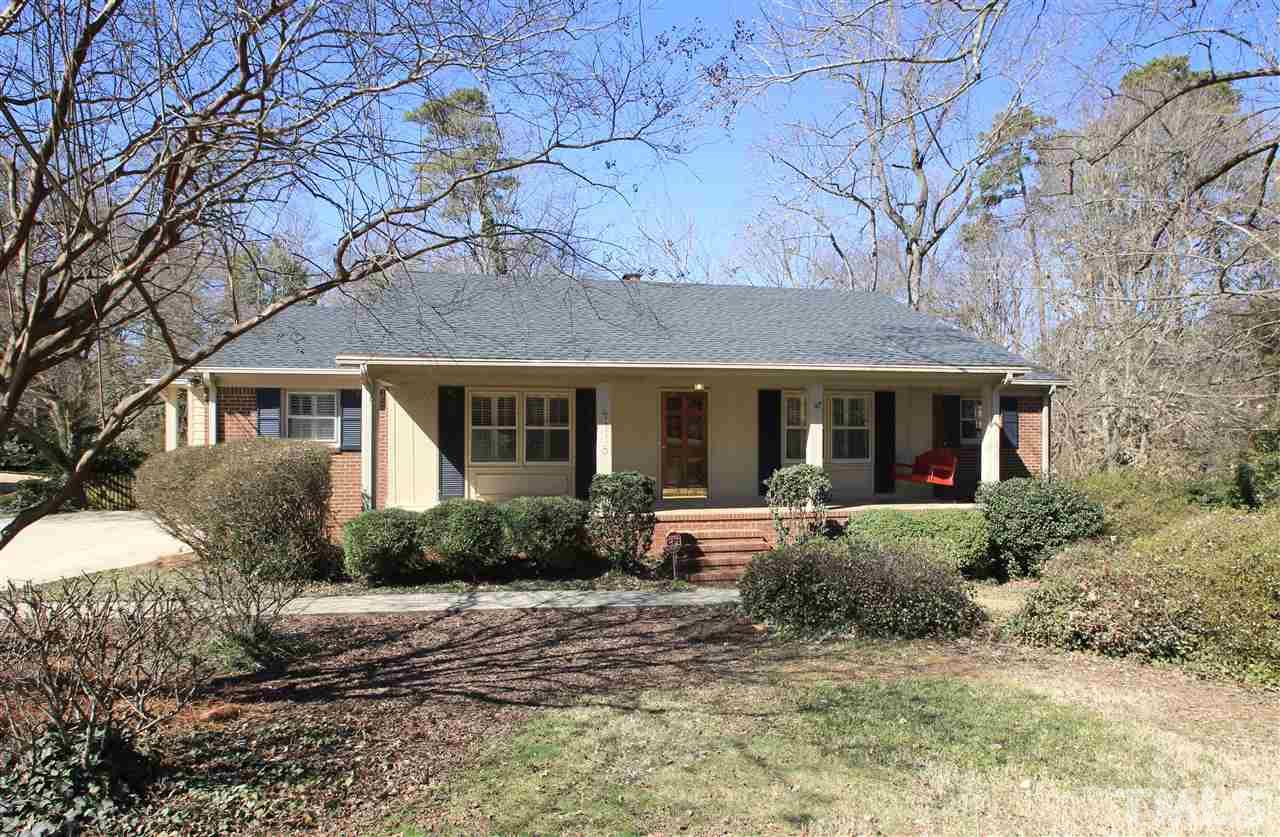 4115 Rockingham Drive Raleigh, NC 27609 - Photo 22 of 23 a front view of a house with garden