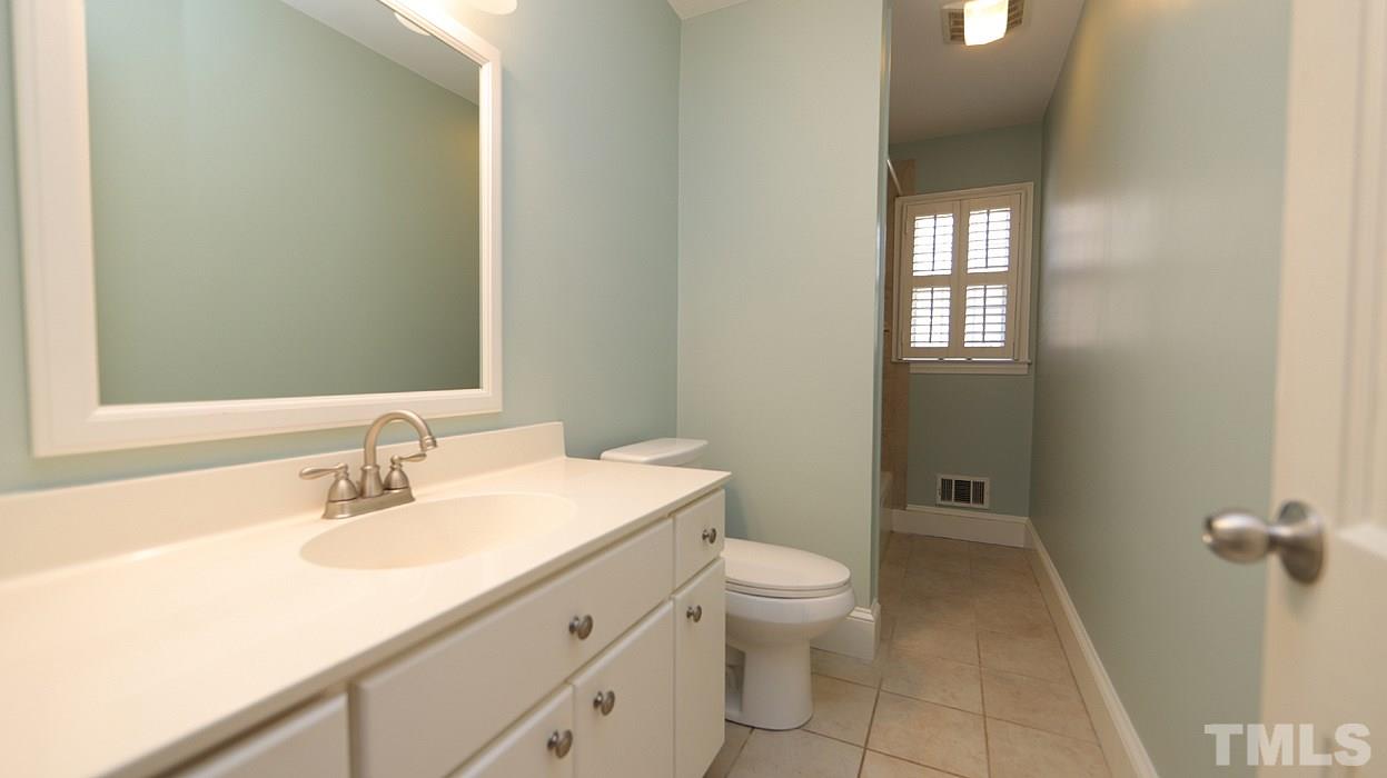 4115 Rockingham Drive Raleigh, NC 27609 - Photo 8 of 23 a bathroom with a sink toilet and shower