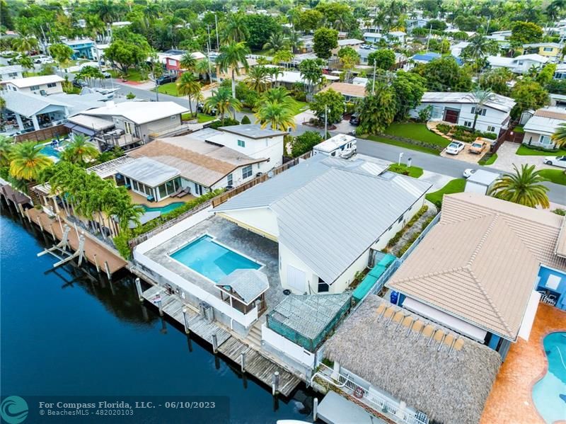 an aerial view of a house with outdoor space ocean view