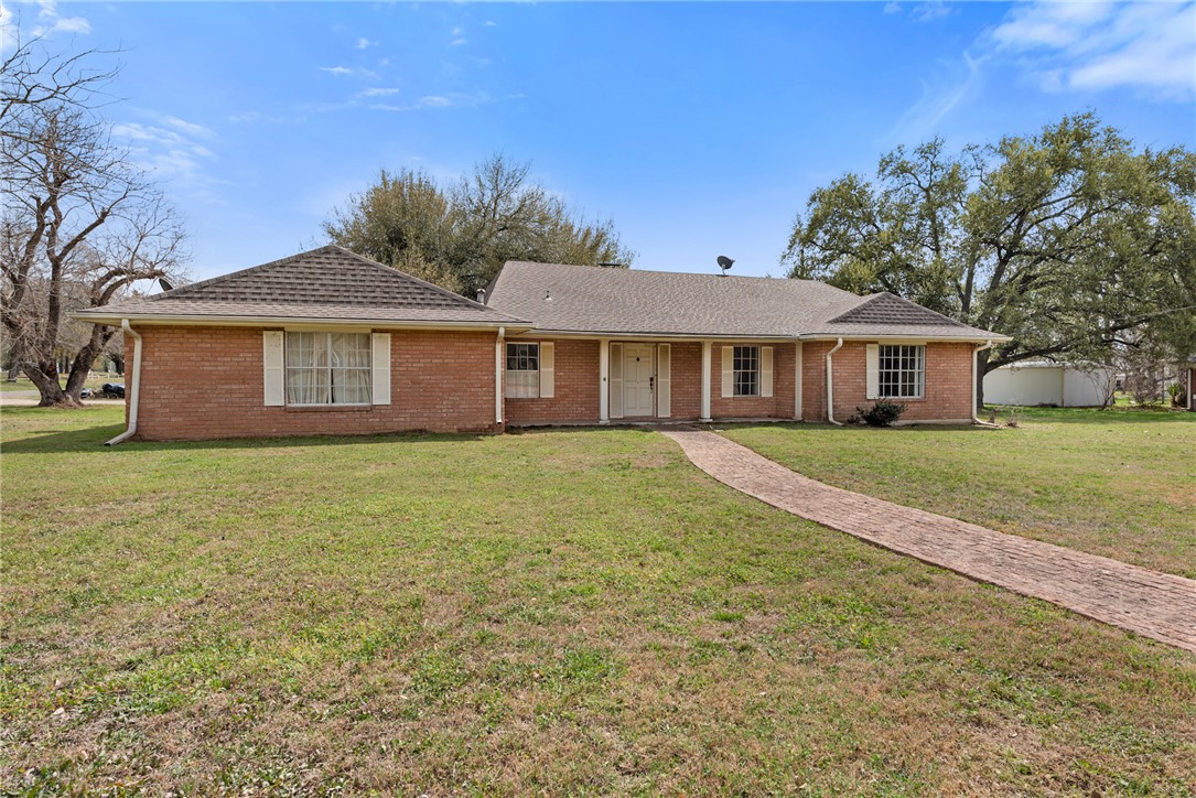 608 Barton Street Calvert, TX 77837 - Photo 1 of 16 a front view of a house with a garden